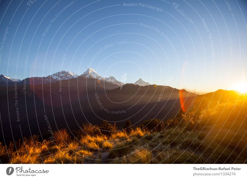 Sunrise at Poon Hill Environment Nature Landscape Blue Brown Yellow Gold Gray Orange Black White Seeming Light Beam of light Sunbeam Mountain Peak Snow Cute