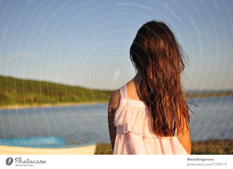 Girl with long hair standing on the shore of lake. Lifestyle Beautiful Vacation & Travel Trip Summer Sun Human being Child Woman Adults Youth (Young adults)