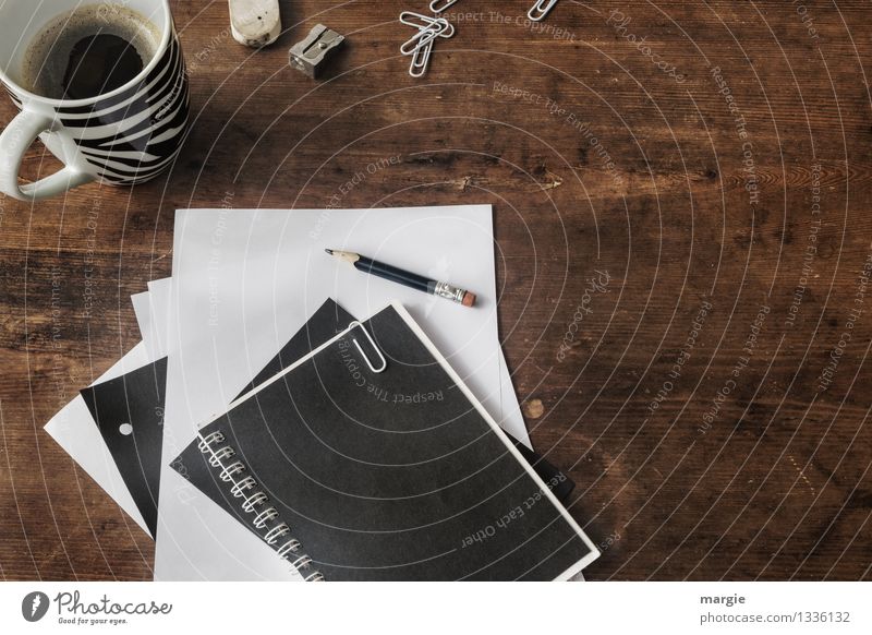 Desk with coffee cup, staples, pencil, paper clips, eraser and sharpener all in black and white Beverage Hot drink Coffee Cup Professional training