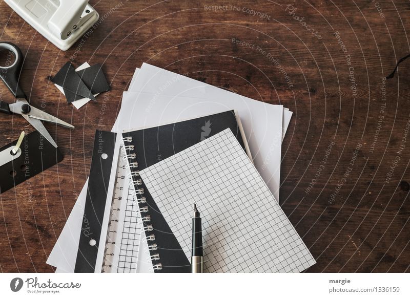 Desk with staplers, paper, pen, scissors, stapler, punch all in black or white Leisure and hobbies Education Science & Research Adult Education School Study