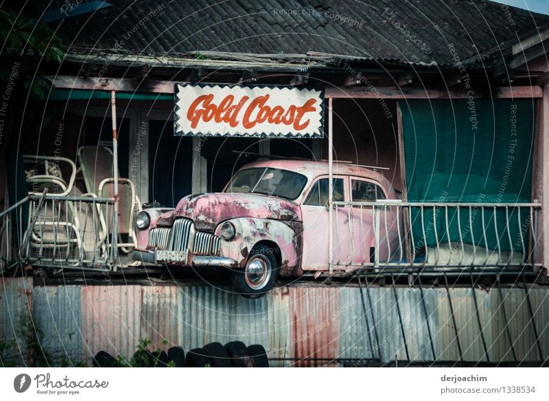 Parking lot found on the Gold Coast. An old car is parked in front of an entrance of an old house coming down. Joy Harmonious Trip Lack of parking spaces Car