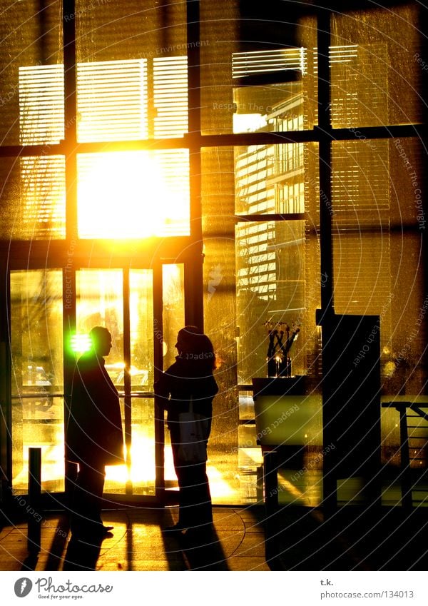 smoking break To talk Human being Woman Adults Man 2 Break Commercial Dusk Colour photo Exterior shot Evening Shadow Sunlight Back-light Group Together Receive