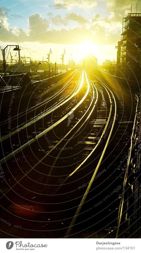 Always further Railroad tracks Back-light Sunset Underground Commuter trains Lighting Glittering Radiation Forwards Right ahead Train station Hamburg