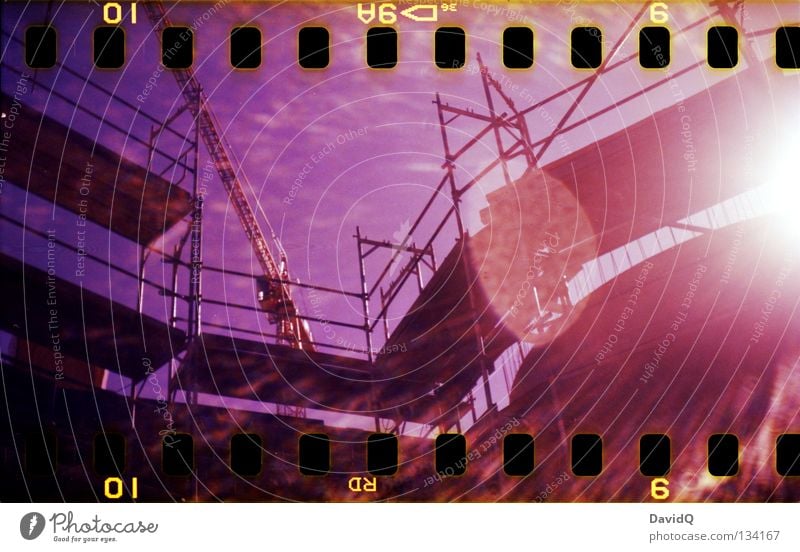 under construction Construction site Framework Crane Sunbeam Patch of light Multicoloured Film Craft (trade) Lomography Scaffold Lens flare Colour color 35mm