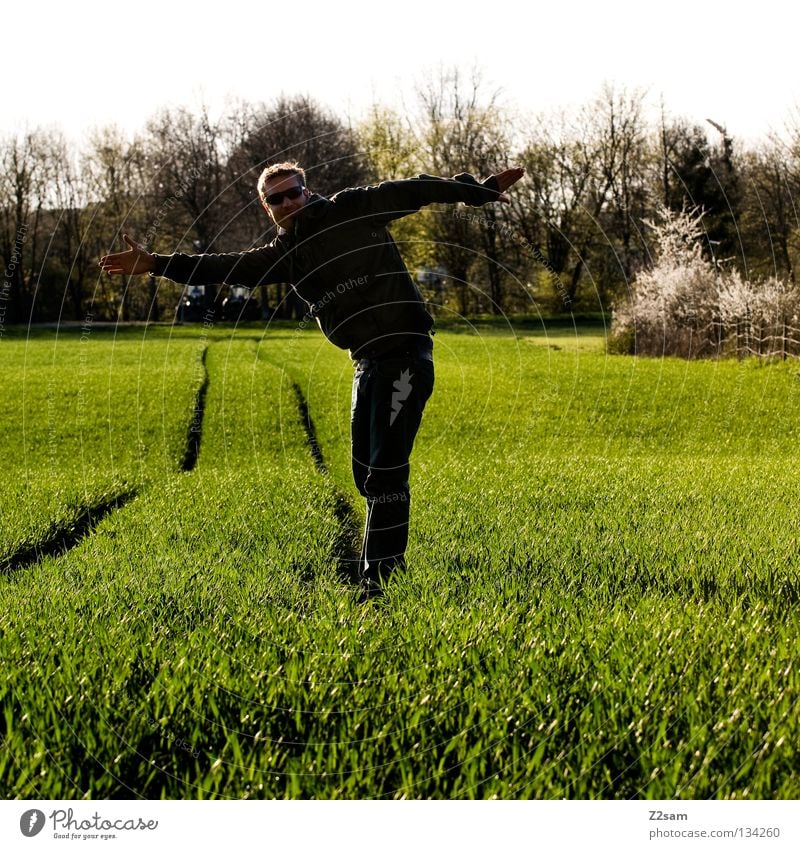 unbalanced Contentment Green Meadow Stripe Field Black Man Masculine Stand Blonde Summer Physics Tree Human being Line Farmer Arm Warmth Nature Landscape