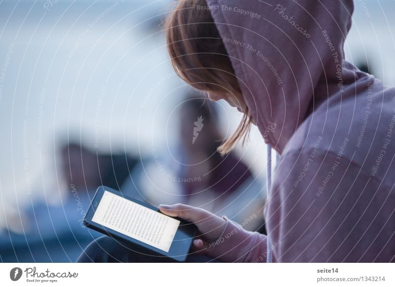 Young woman reading an ebook on her e-book reader Beautiful Leisure and hobbies Reading Vacation & Travel Beach Feminine Youth (Young adults) Adults 1