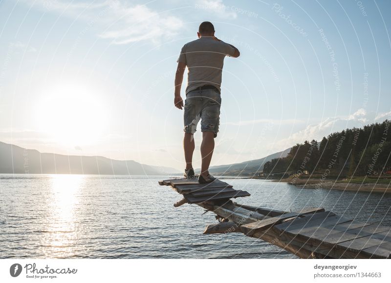 Boy in front of mountain dam Lifestyle Happy Beautiful Relaxation Leisure and hobbies Vacation & Travel Tourism Adventure Camping Summer Mountain Hiking Sports