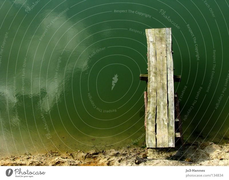 restart Footbridge Wood Wooden board Ocean Lake Pond Water Turquoise Beach Reflection Mirror Clouds Boating trip Launch pad New start Bird's-eye view Ecological