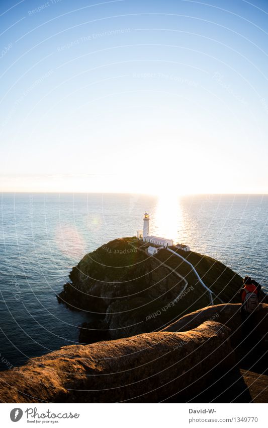 Lighthouse at sunset Ocean ocean Illuminate Coast Water Exterior shot Colour photo Sky Landscape Nature Vacation & Travel Beautiful weather Tourism Island Blue