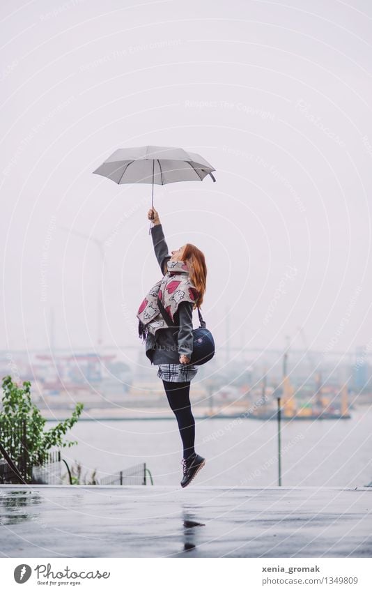 Woman with umbrella jumps up Lifestyle Well-being Contentment Leisure and hobbies Playing Vacation & Travel Trip Adventure Freedom Young woman