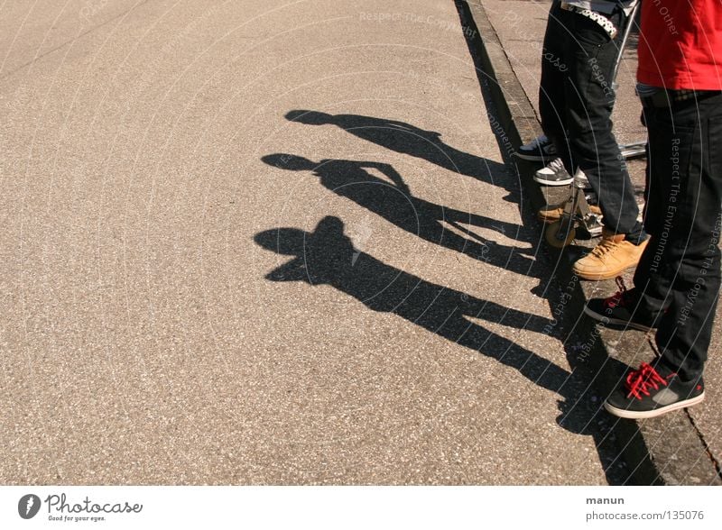 Shadowmen III Colour photo Subdued colour Exterior shot Detail Copy Space left Copy Space bottom Neutral Background Day Light Contrast Silhouette Sunlight