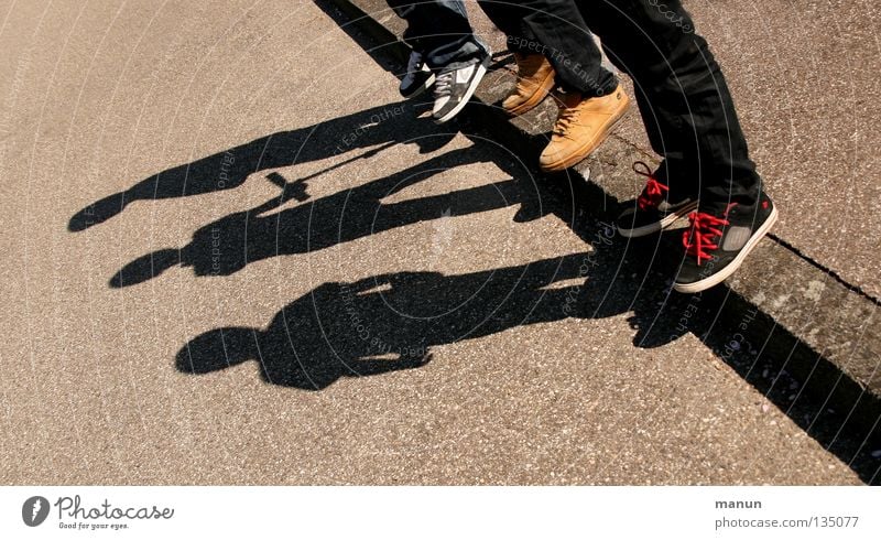 Shadowmen IV Shadow play Human being Friendship Youth (Young adults) Legs Feet 3 Street Asphalt Movement Wait Authentic Together Uniqueness Natural Agreed