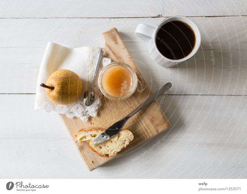 Breakfast with pear jam Fruit Jam Vegetarian diet Diet Coffee Cup Spoon String Fresh Baguette Pear pears organic Glass Preserving jar Eating Wooden table