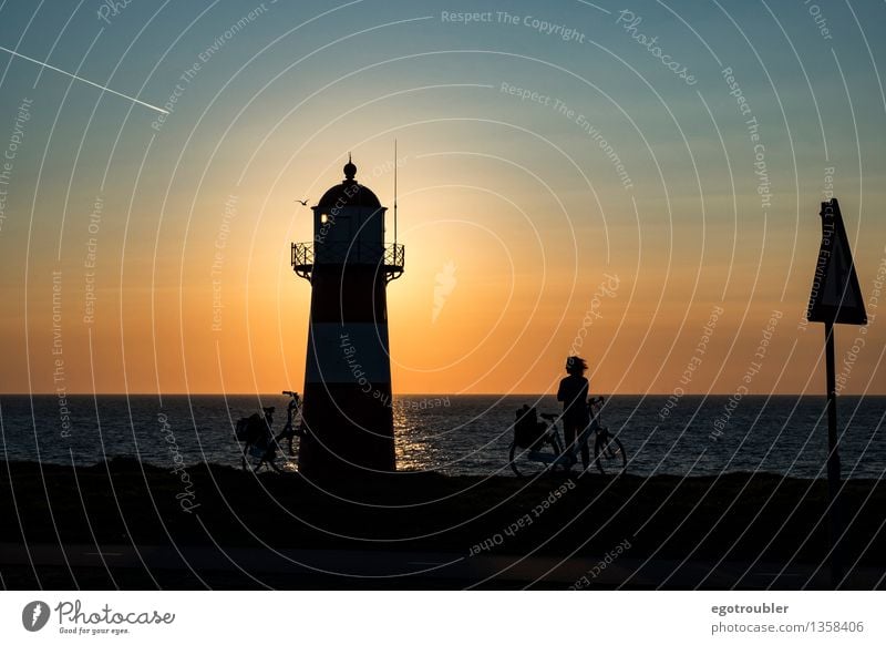 lighthouse Bicycle Vacation & Travel Cycling tour Beach Ocean Woman Adults 1 Human being Water Sky Horizon Sunrise Sunset Autumn Beautiful weather Coast