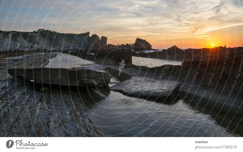 prefabricated building Nature Landscape Water Sky Clouds Horizon Sunrise Sunset Weather Beautiful weather Rock Coast Bay Fjord Ocean Blue Brown Gold Gray White