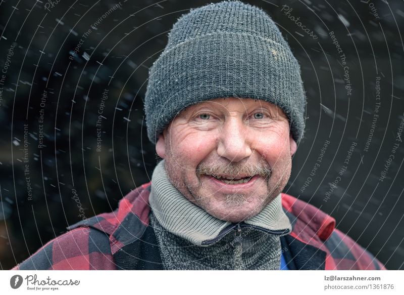 Happy man with a mustache in a knitted winter cap and warm winter clothing Face Winter Snow Craftsperson Man Adults Weather Fashion Jacket Hat Moustache Smiling