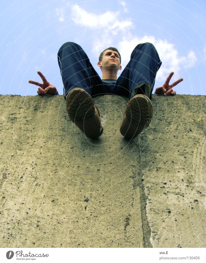 THE WALL | peace, brother Man Masculine Youth (Young adults) Fellow Posture Goof off Rest To enjoy Calm Relaxation Clouds Bad weather Summer Wall (barrier)