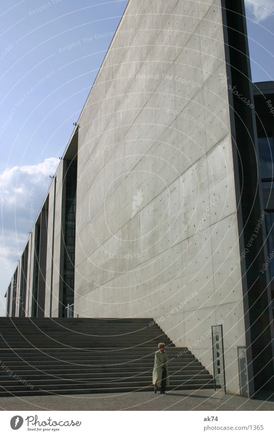 Old woman in front of wall Wall (building) Concrete Gray Loneliness Architecture Sky Stairs Berlin Reichstag