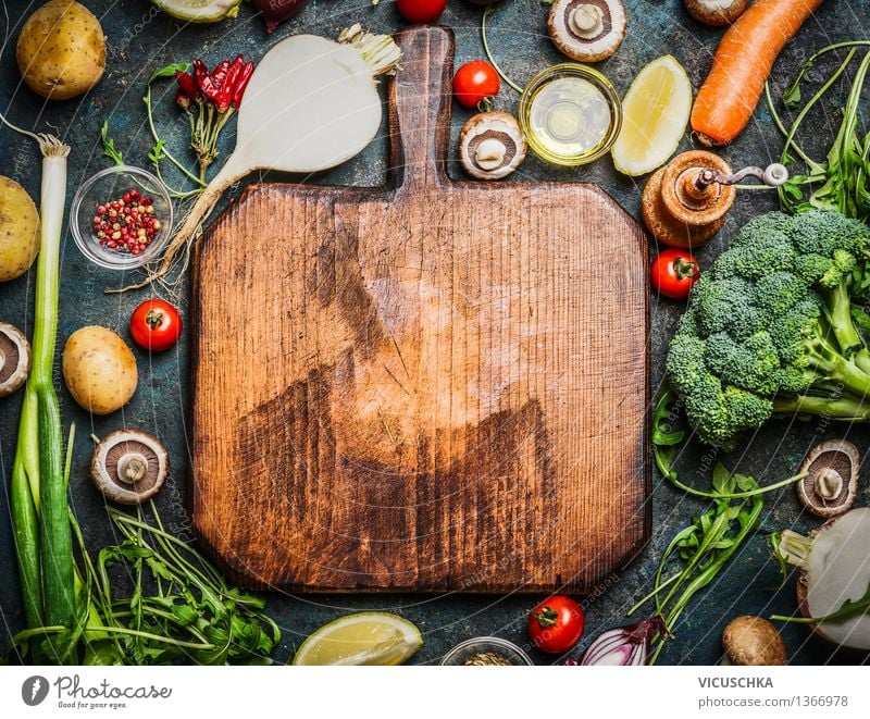 Fresh vegetables and ingredients for cooking around chopping board Food Vegetable Lettuce Salad Herbs and spices Cooking oil Nutrition Lunch Dinner