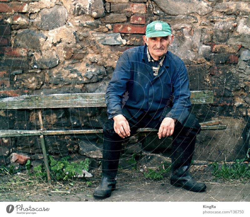 The last big farmer Wall (barrier) Portrait photograph Derelict Brick Man Farmer Bench Old Tilt