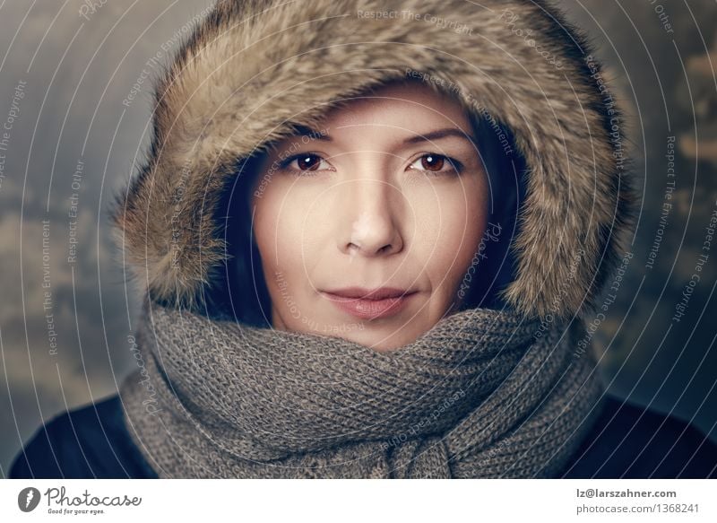 Pretty young woman in brown fur hood Style Beautiful Face Winter Woman Adults 1 Human being Warmth Fashion Fur coat Scarf Hat Smiling Friendliness attractive