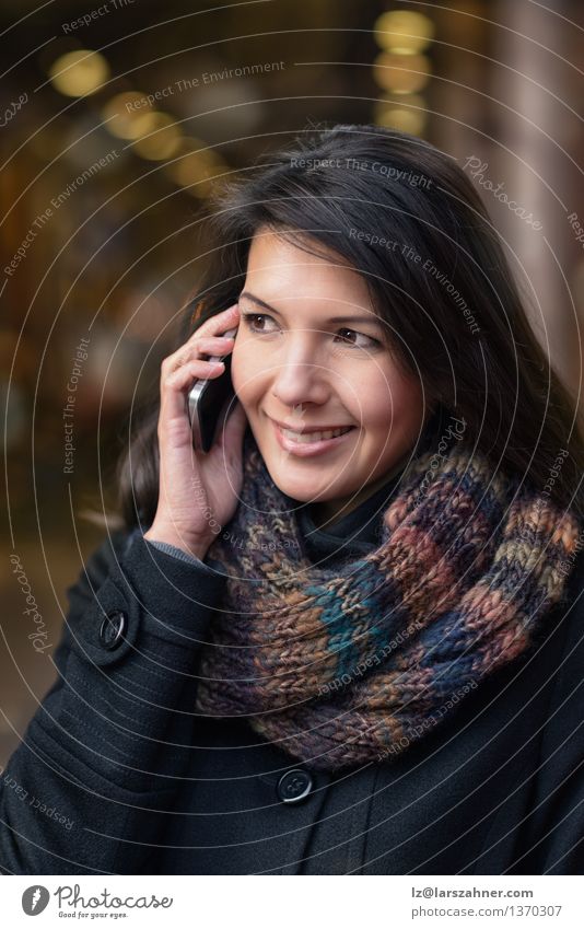 Smiling Woman in Autumn Fashion Talking on Phone Lifestyle Happy Beautiful Face Winter To talk Telephone PDA Adults 1 Human being 30 - 45 years Town Street Coat