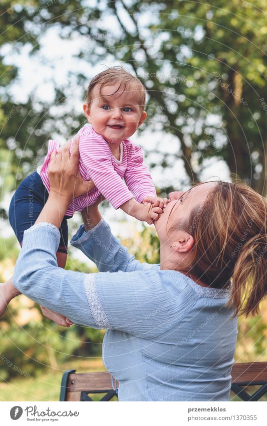 Mom playing with her little daughter in the garden Lifestyle Joy Happy Beautiful Child Baby Toddler Girl Woman Adults Parents Mother Family & Relations 2