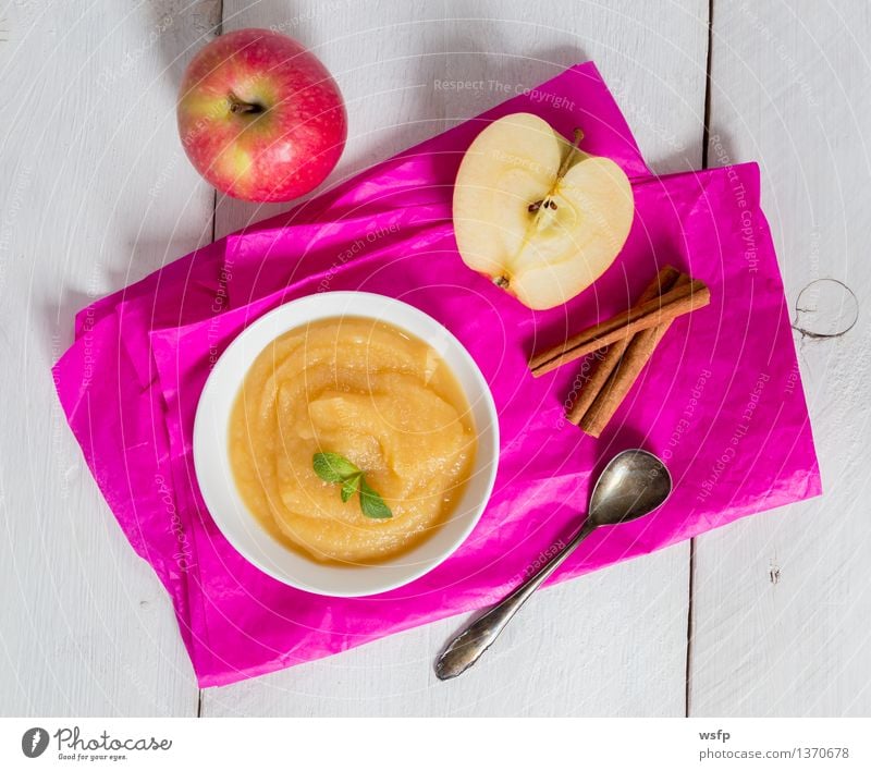 Apple sauce on pink paper and spoon Dessert Vegetarian diet Spoon Pink Apple puree apple porridge Puree Baby food Compote Sweet Fruity Cinnamon Country house