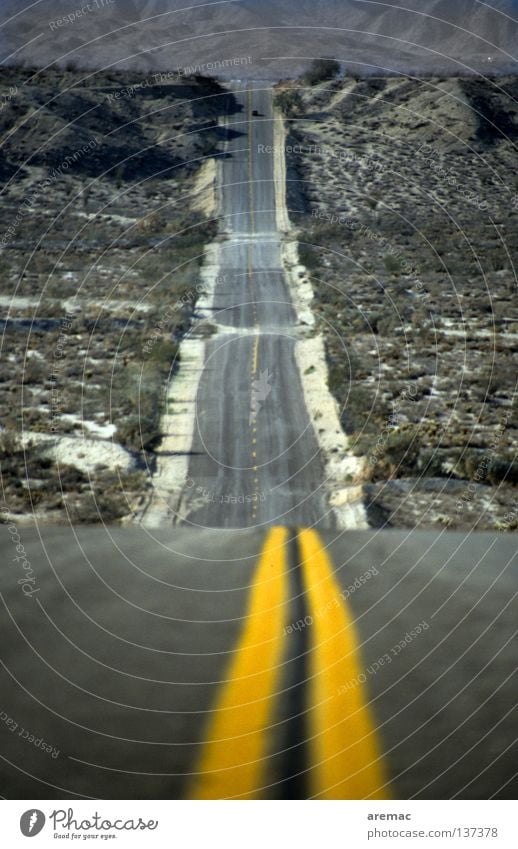 Downhill and then straight ahead Long Right ahead Downward Yellow Transport Center line Americas Arizona USA Desert Street Lanes & trails Line Mountain