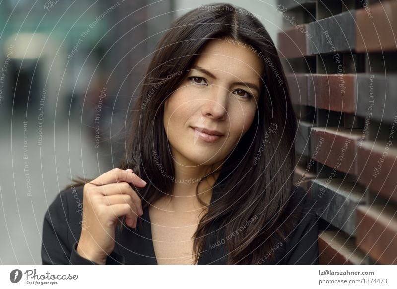 Portrait of a middle aged woman Face Far-off places Woman Adults Brunette Hair Think Smiling Dream Considerate Puzzle Attractive Brick Contemplative Copy Space