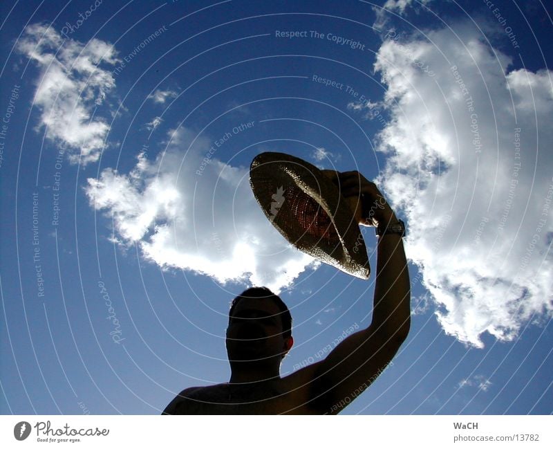 shadow man Clouds Straw Sky Summer Man Shadow play Upper arm Biceps Triceps Shoulder Black Hand Welcome Converse Upper body Joy straw hat has cloud Blue blu