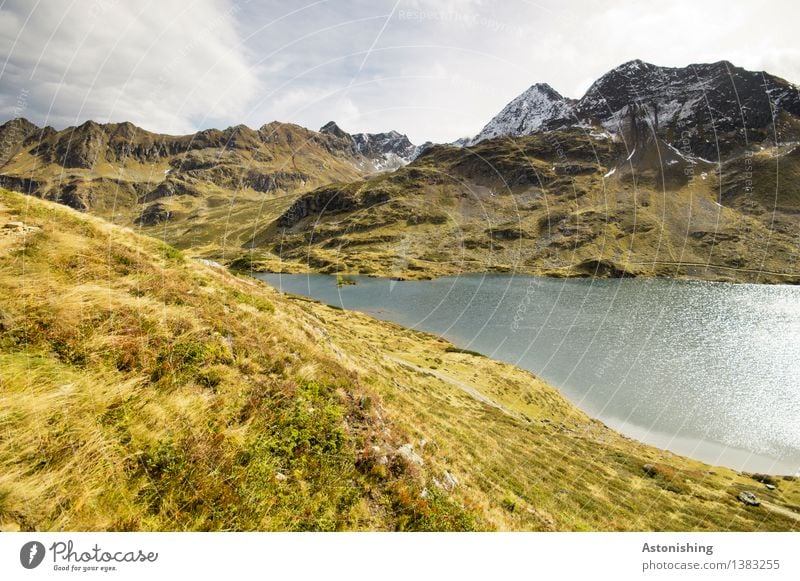 mountain lake Environment Nature Landscape Plant Air Sky Clouds Horizon Autumn Weather Grass Bushes Meadow Hill Rock Alps Mountain Peak Snowcapped peak Waves