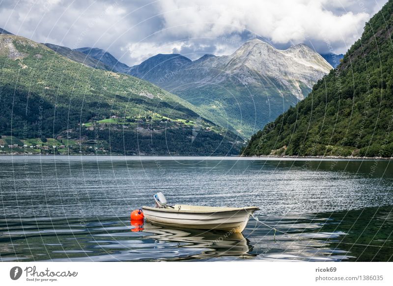 Boat at the Storfjord Relaxation Vacation & Travel Mountain Nature Landscape Water Clouds Fjord Motorboat Watercraft Idyll Tourism Norway North Dal