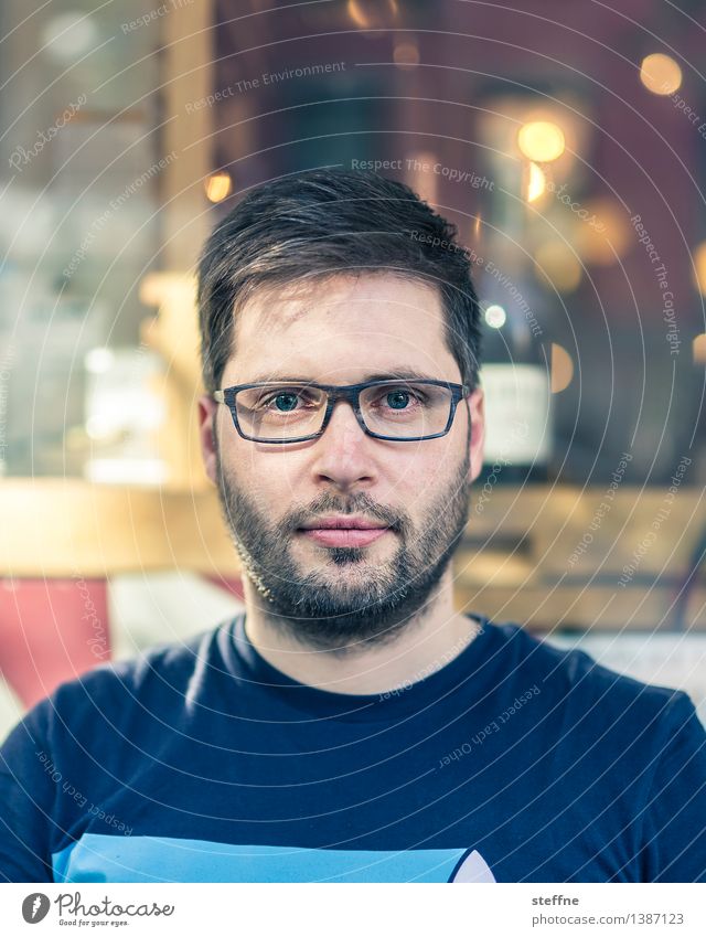 NYC hipster victim. Guy Hipster Eyeglasses Portrait photograph Young man steffne Facial hair Designer stubble Café