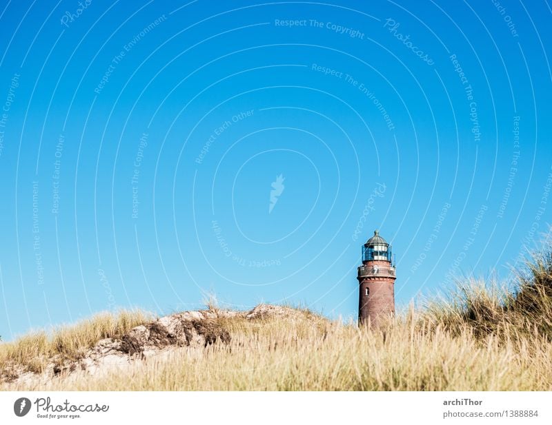 beach guard Beach Lighthouse operator Marram grass Deserted Stone Sand Brick Bright Warmth Blue Brown Green Vacation & Travel Dune Cloudless sky Sandy beach