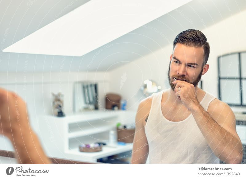 Bearded man brushing his teeth Face Health care Mirror Bathroom Man Adults Teeth Toothbrush Modern Clean caries cleaning cleanliness Dental Dentistry grooming