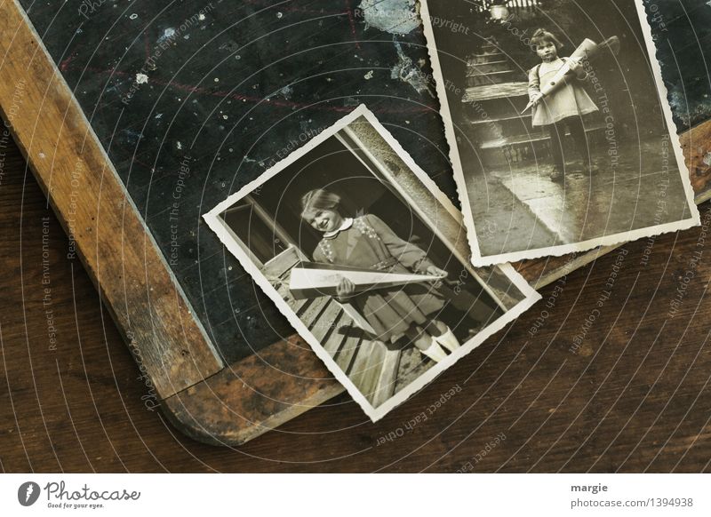 First day of school! An old blackboard with two photos. On it schoolgirls with a sugar cube to start school Education School Study Blackboard Schoolchild