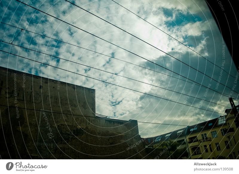 BLN 08 | Going home Train travel Window Vantage point House (Residential Structure) Old building Wall (building) Germany Washed out Clouds Cirrus Fraud Berlin