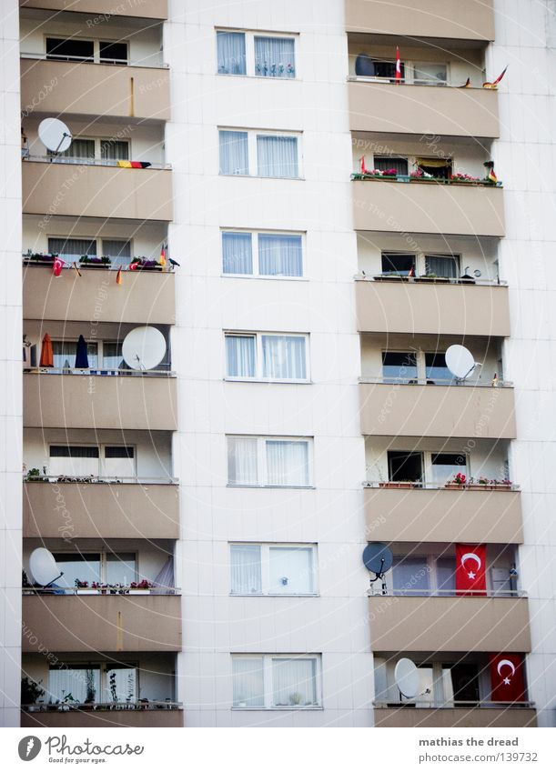 CULTURAL WITH EACH OTHER Tower block Prefab construction Balcony Facade Section of image Partially visible Detail Dish antenna Gloomy Simple Window Architecture