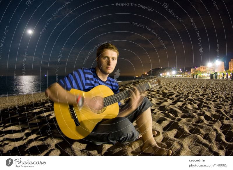 guitar hero Guitar Man Sand Beach Playing Music Make music Musician Artistically talented Moon Long exposure Spain Night Ocean Reflection Legs Pants Jeans Sit