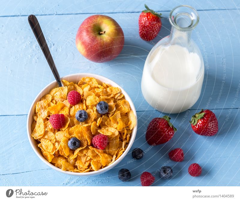 Cornflakes in a bowl Fruit Apple Breakfast Milk Bowl Wood Blue breakfast cereals Flake Blueberry Cereals raspberry Strawberry Grain Eating shell Blue background