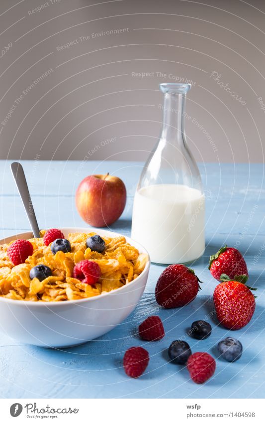 Cornflakes in a bowl Fruit Apple Breakfast Milk Bowl Wood Blue breakfast cereals Flake Blueberry Cereals raspberry Strawberry Grain Eating shell Blue background