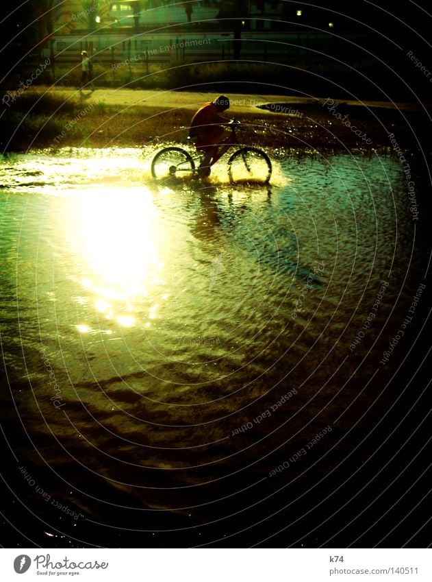 bicycle children Bicycle Tire Human being Joie de vivre (Vitality) Joy Happy Playing Romp Refreshment Refrigeration Puddle Flood Railroad Splashing Water