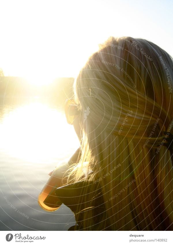 Against the sun Sun Hair and hairstyles Blonde Gold Drinking Water Lake Pond Sunglasses Summer February Sunbeam Dazzle Sunset To enjoy Woman Beach Horizon