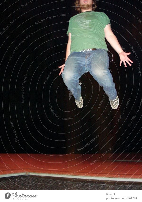 jump Red Jump Trampoline Denim Man Facial hair Hand Green Night Black Joy Effort Pants Legs Fingers T-shirt Dark Hop Kinetic energy Gravity Weightlessness