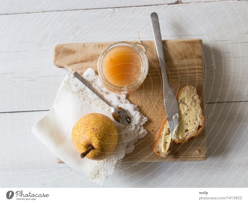 Breakfast with pear jam Fruit Jam Vegetarian diet Diet Cup Spoon String Fresh Baguette Pear pears organic Glass Preserving jar Eating Wooden table