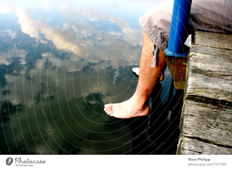 let down Colour photo Exterior shot Copy Space left Day Reflection Calm Vacation & Travel Freedom Summer Young man Youth (Young adults) Man Adults Legs Feet 1