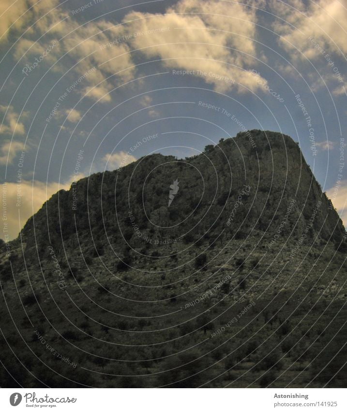 the rock Mountain Plant Sky Clouds Rock Stone Dark Gray Spain Contrast Steep Steep face Deserted Landscape Clouds in the sky Sparse Rock formation