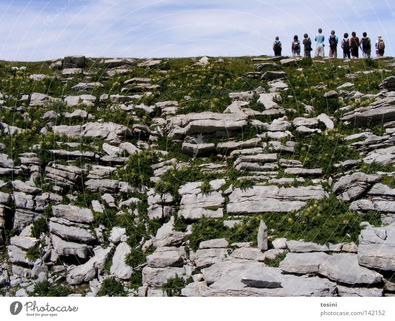 small people, big nature [1/5] Sky Mountain Human being Vantage point Far-off places Stone Rock Grass Nature Hiking Group Small Large Clouds Backpack