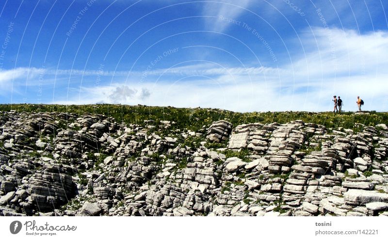 small people, big nature [2/5] Sky Mountain Human being Vantage point Far-off places Stone Rock Grass Nature Hiking Group Small Large Clouds Backpack